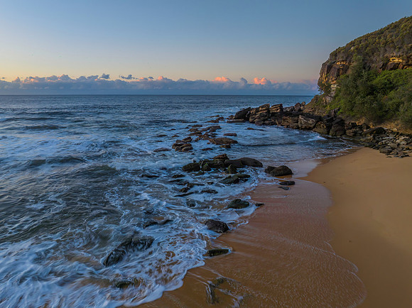 Aerial sunrise at the beach with clouds
