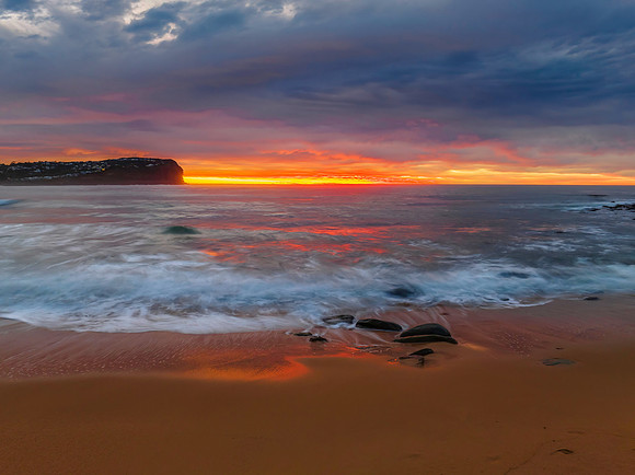 Cloud filled sunrise seascape