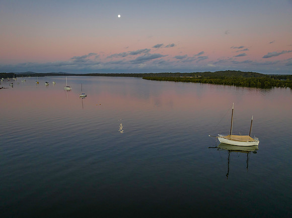 Sunset over the river with boats