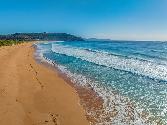 A Perfect Day by the Sea Under Clear Blue Skies