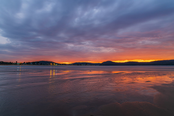 Colourful cloud filled sunrise at the seaside