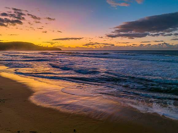 Aerial sunrise at the beach with clouds