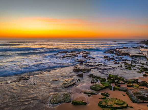 Sunrise at the Seaside with an Orange Horizon