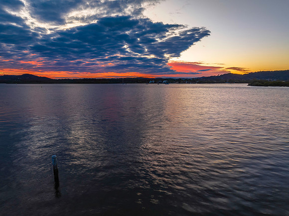 Sunrise over the bay with cloud cover moving in