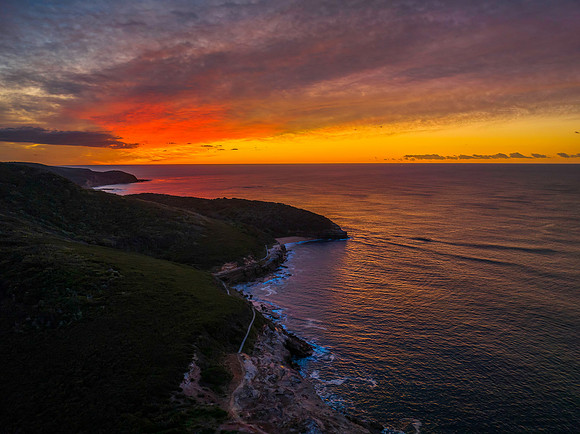High cloud sunrise over the beach and mountain