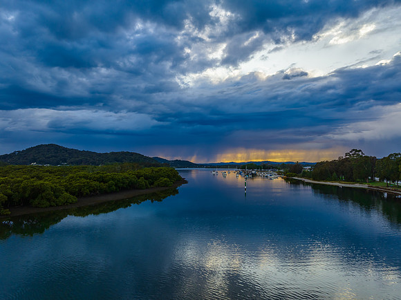 Early morning storm light and reflections at the waterfront