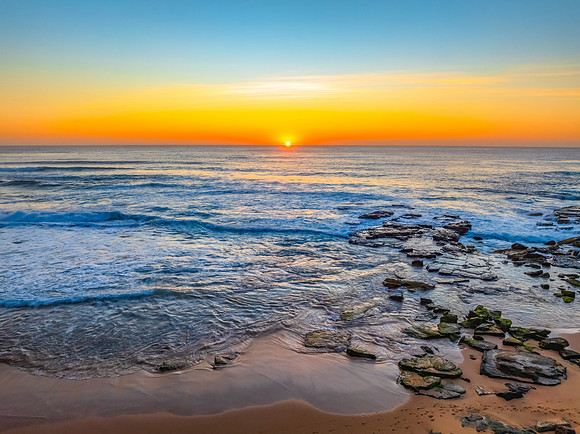 Sunrise at the Seaside with an Orange Horizon