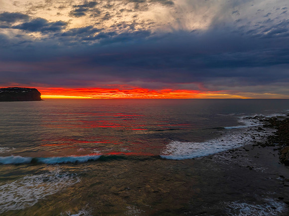 Cloud filled sunrise seascape