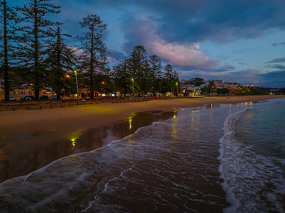 Aerial sunrise at the seaside with rain clouds