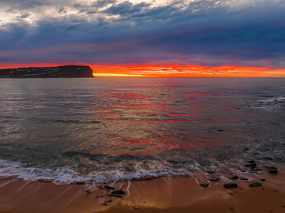 Cloud filled sunrise seascape