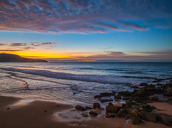 Winter seascape views over the beach with high and medium cloud