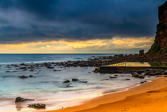 Cloud covered sunrise at the seaside