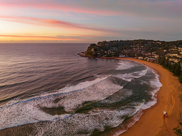 Sunrise and high cloud cover by the sea and lagoon