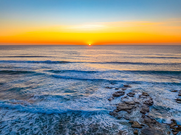 Sunrise at the Seaside with an Orange Horizon