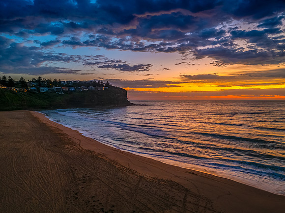 Pretty Sunrise at the seaside with rain clouds