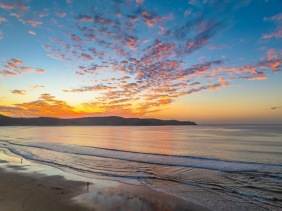 Sunrise seascape with pretty clouds in the sky