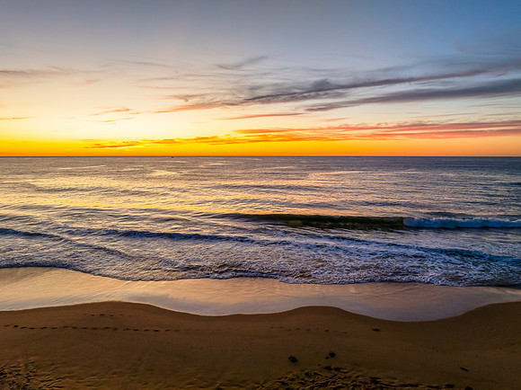 Sunrise at the seaside with high cloud