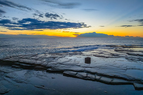 Sunrise over the ocean and rocky Inlet