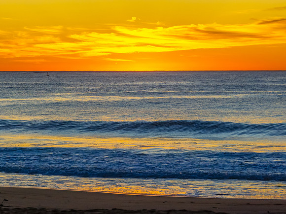 Sunrise at the seaside with high cloud