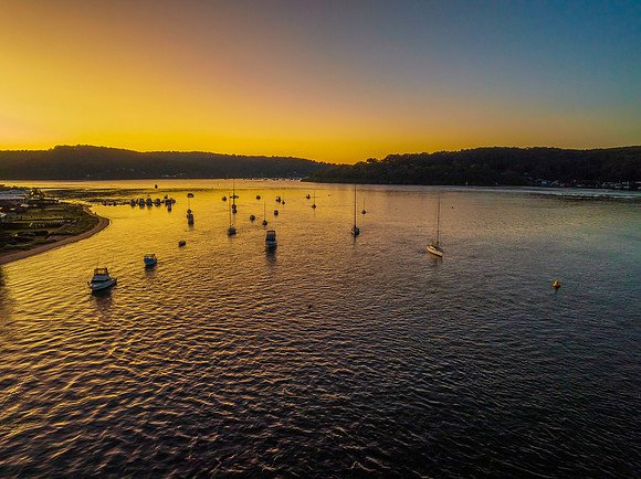 Aerial sunrise waterscape with clear skies
