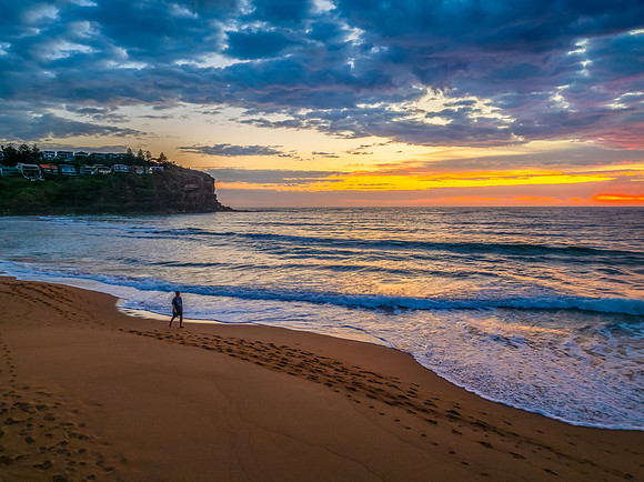 Pretty Sunrise at the seaside with rain clouds