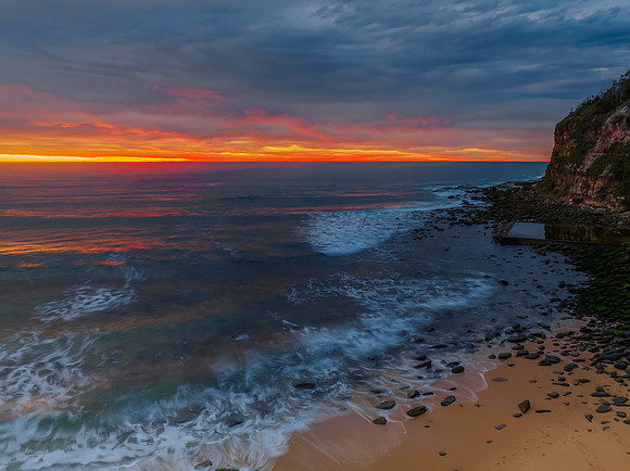 Cloud filled sunrise seascape