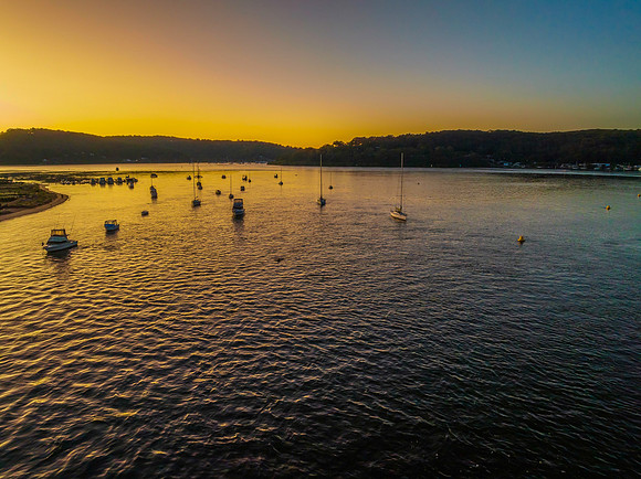 Aerial sunrise waterscape with clear skies