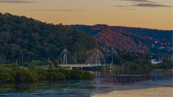 Bridge over the bay with mountain back drop
