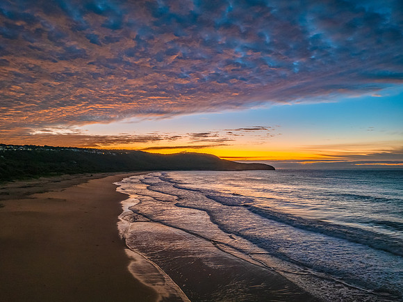 Winter seascape views over the beach with high and medium cloud