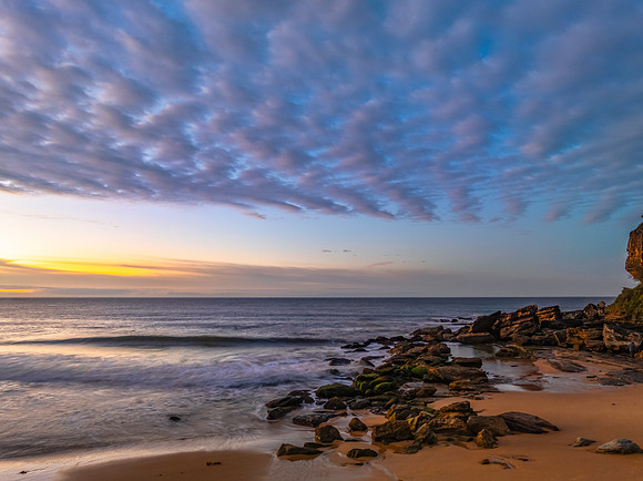 Winter seascape views over the beach with high and medium cloud