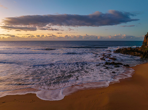 Aerial sunrise at the beach with clouds