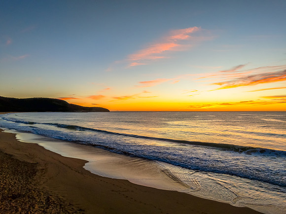 Sunrise at the seaside with high cloud