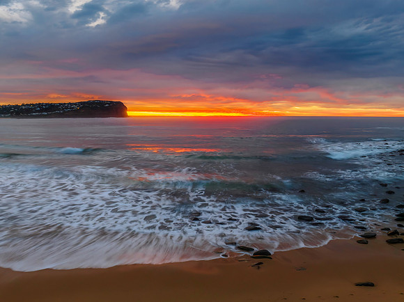 Cloud filled sunrise seascape