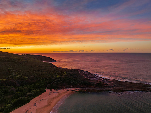 High cloud sunrise over the beach and mountain