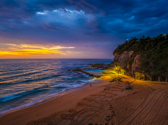 Pretty Sunrise at the seaside with rain clouds