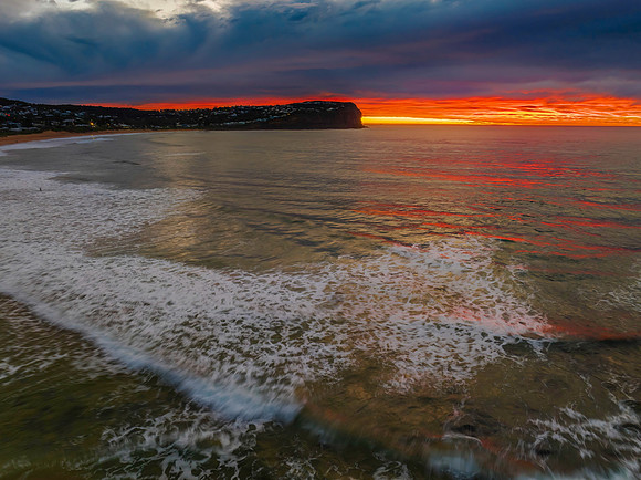 Cloud filled sunrise seascape