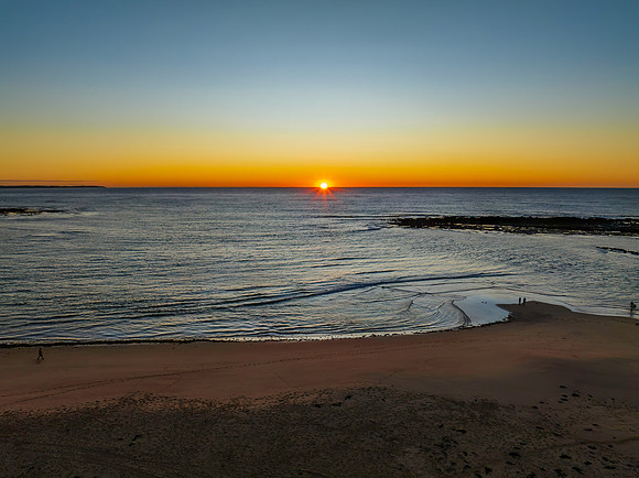 Aerial sunrise seascape with  clear skies