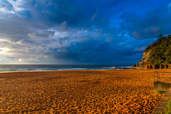 Sunrise at the Seaside with rain clouds