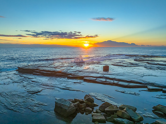 Sunrise over the ocean and rocky Inlet
