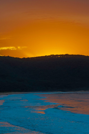 Vivid Orange and Blue Sunrise Seascape with Headland