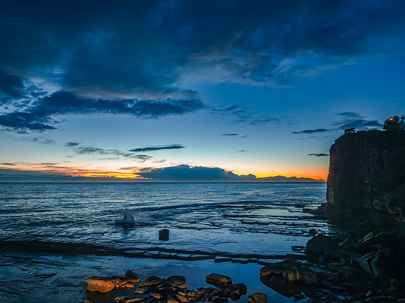 Sunrise over the ocean and rocky Inlet