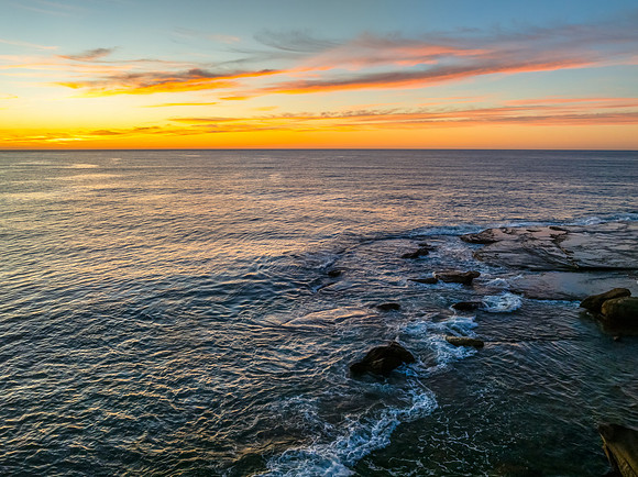 Sunrise at the seaside with high cloud