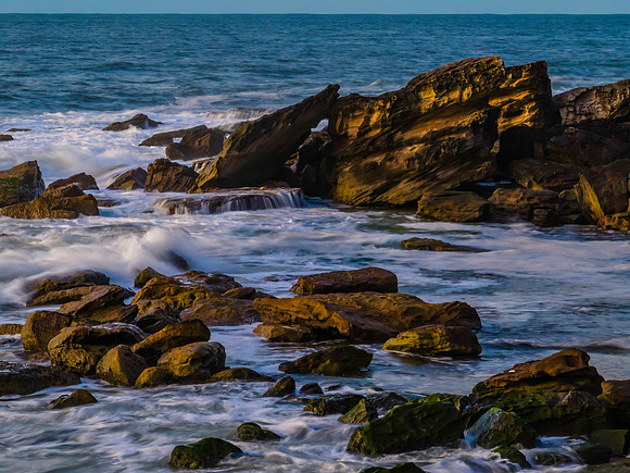 Sea and rocks in the sunrise light