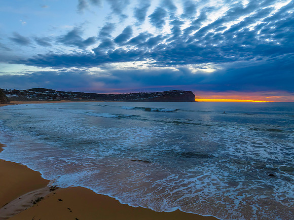 Cloud filled sunrise seascape
