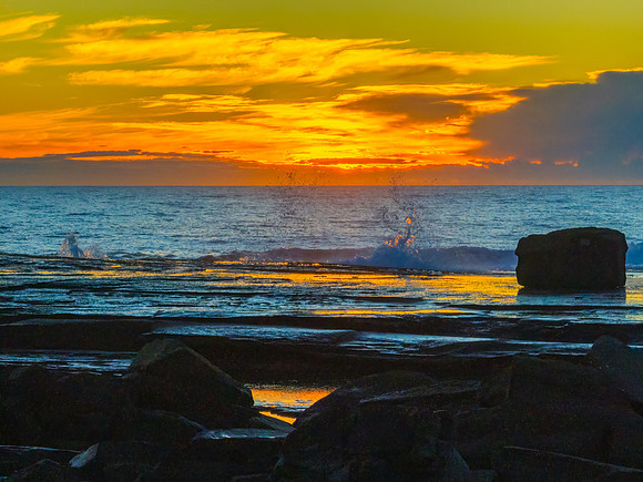 Sunrise over the ocean and rocky Inlet
