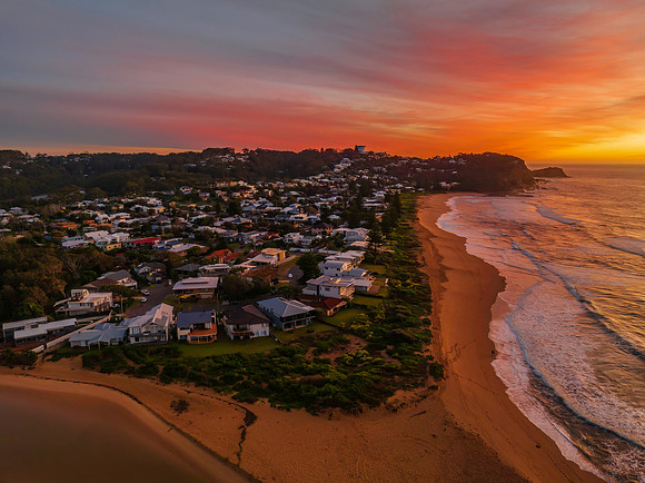 Sunrise and high cloud cover by the sea and lagoon