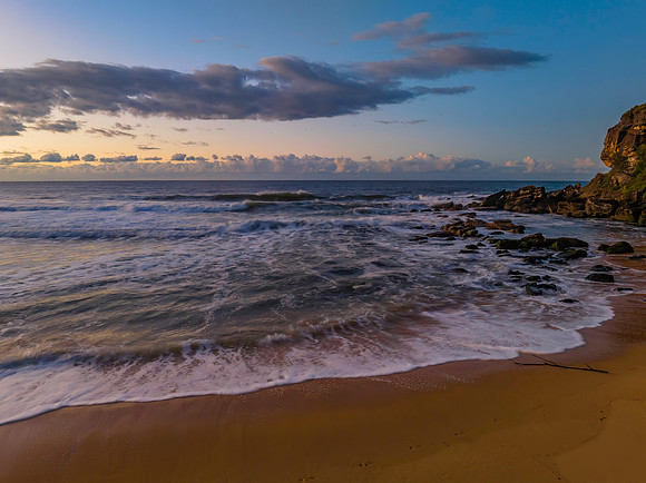 Aerial sunrise at the beach with clouds