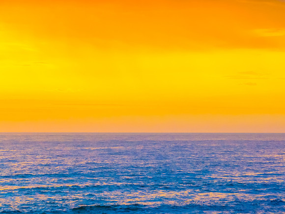 Pretty Sunrise at the seaside with rain clouds