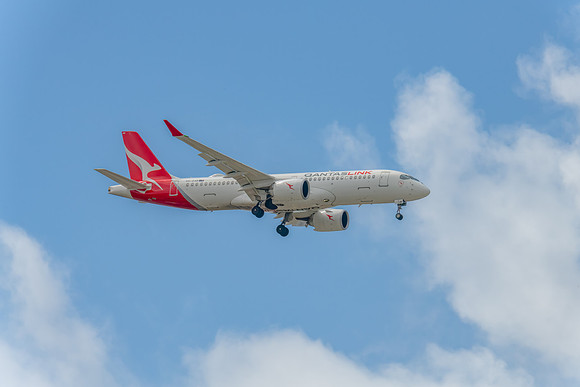 VH-X4B - Airbus A220-300 - QantasLink Aircraft in the blue sky w