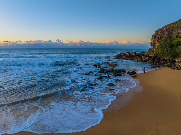 Aerial sunrise at the beach with clouds